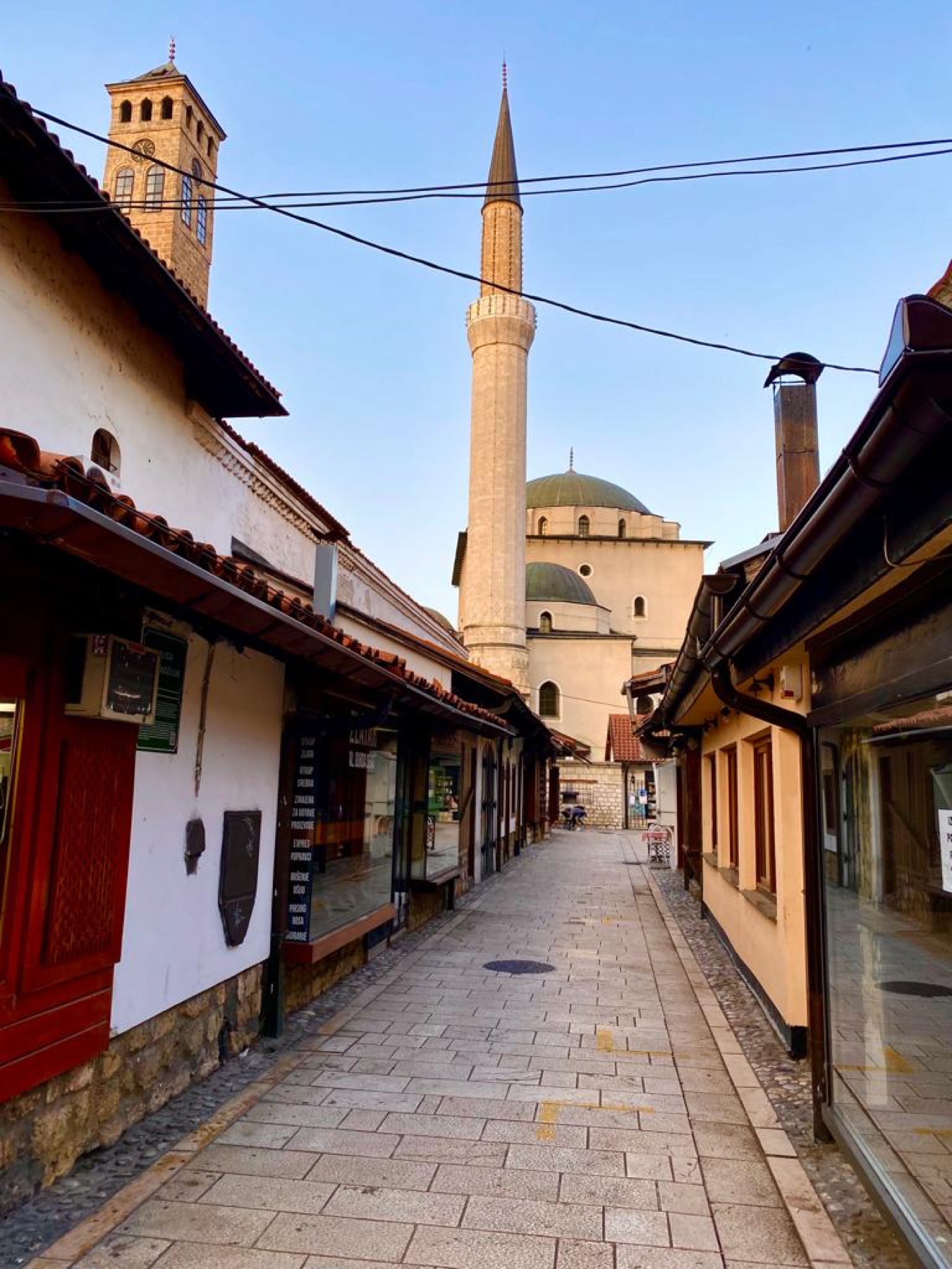 Baščaršija street in Sarajevo with a mosque minaret