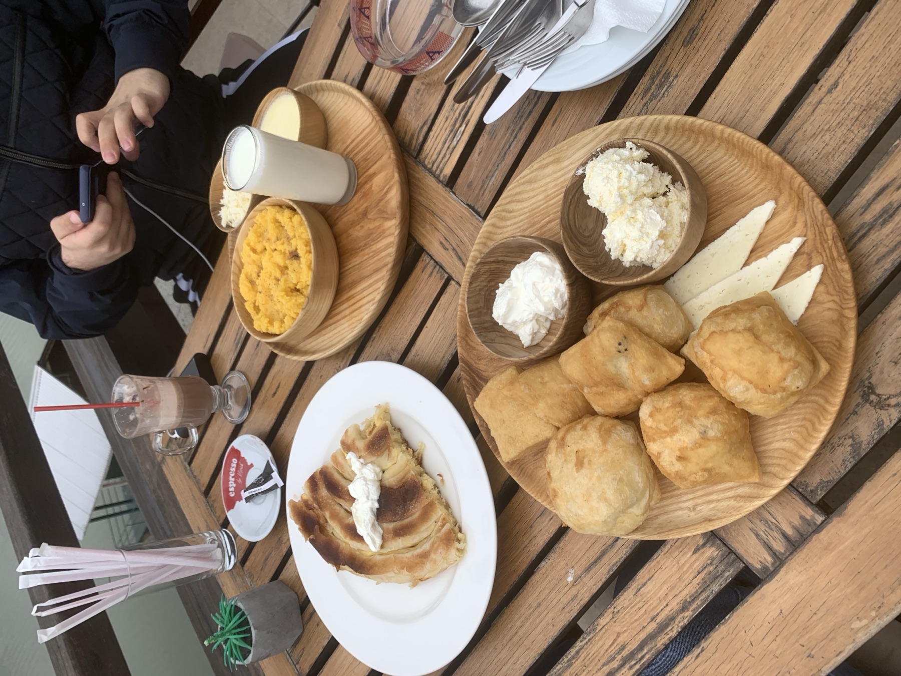 Bosnian pita with kajmak and jogurt on a café table in Sarajevo